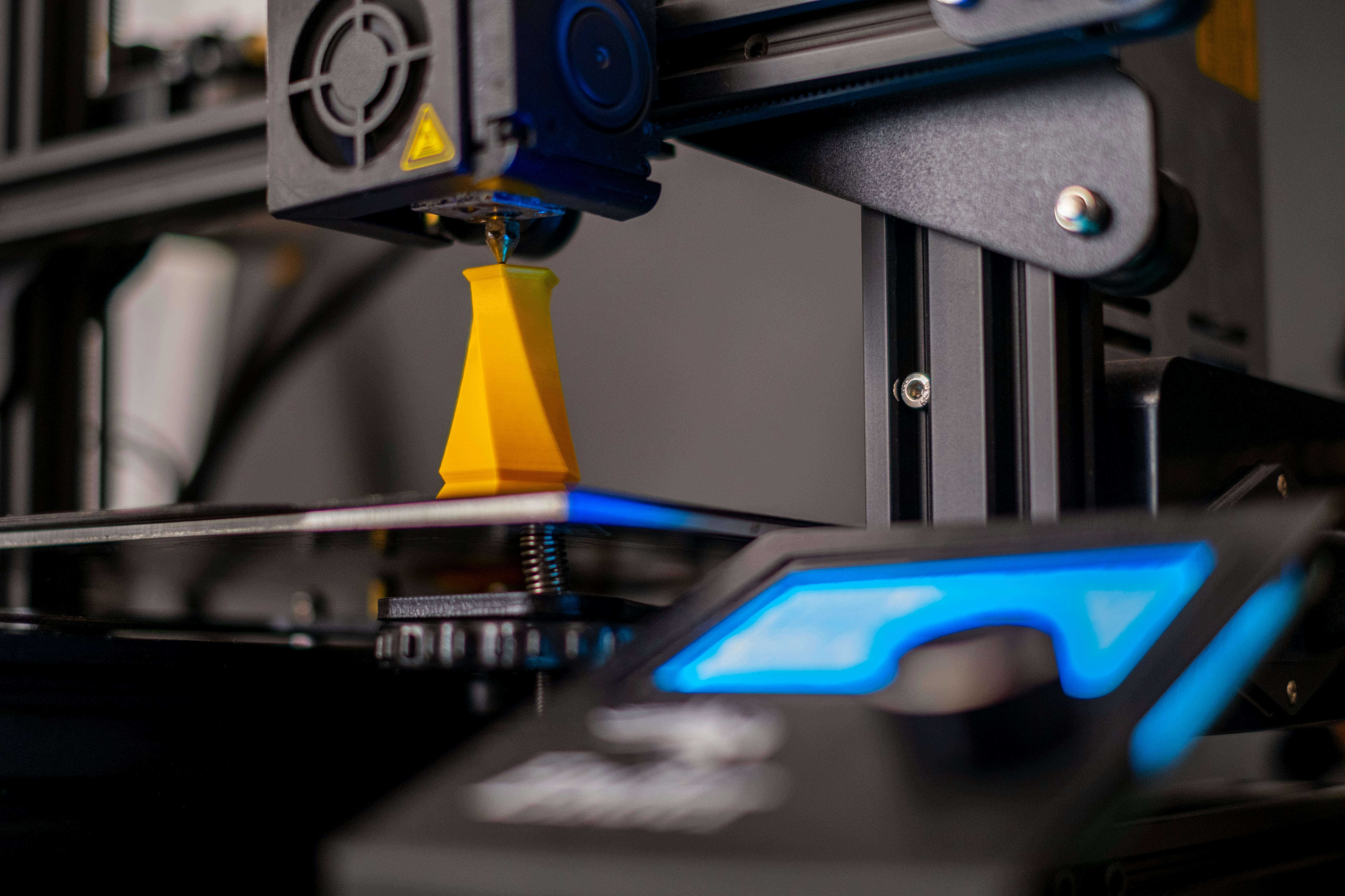 3D printer printing a machine part